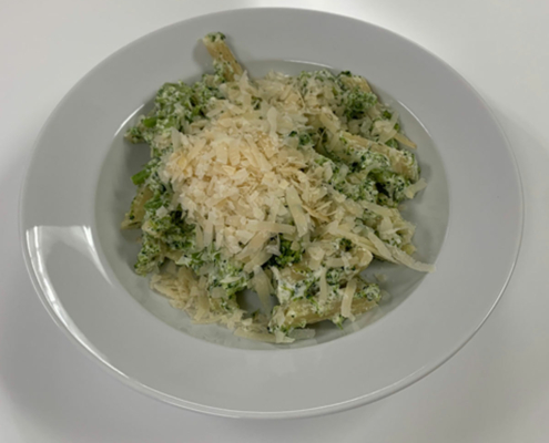 Pasta dish with penne pasta, broccoli and cheese