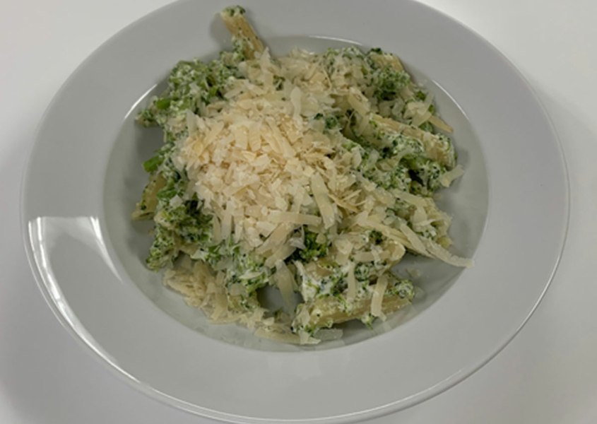 Pasta dish with penne pasta, broccoli and cheese
